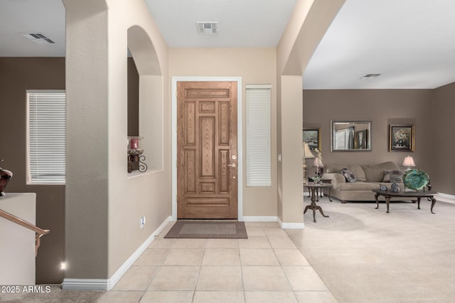 entryway with light tile patterned flooring