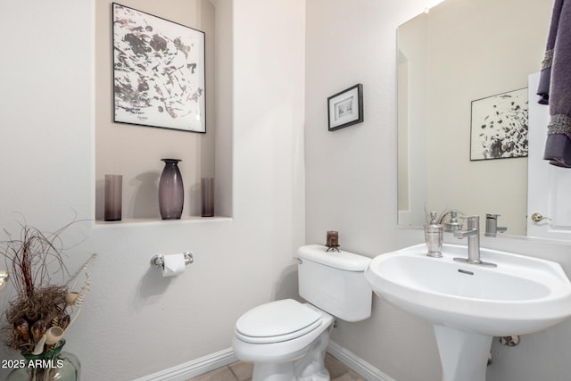 bathroom featuring sink and toilet