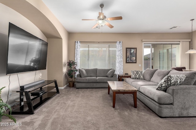 living room with ceiling fan and light carpet