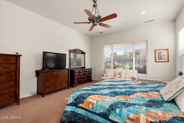 bedroom featuring ceiling fan and light colored carpet