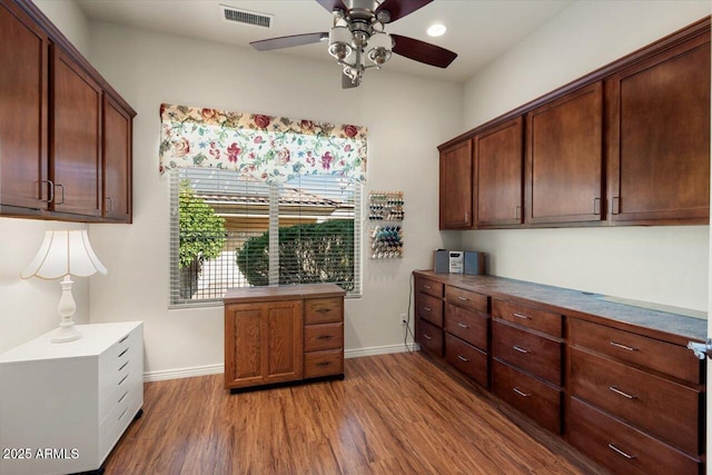 interior space with hardwood / wood-style flooring and ceiling fan