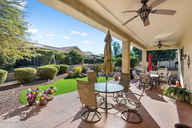 view of patio featuring ceiling fan