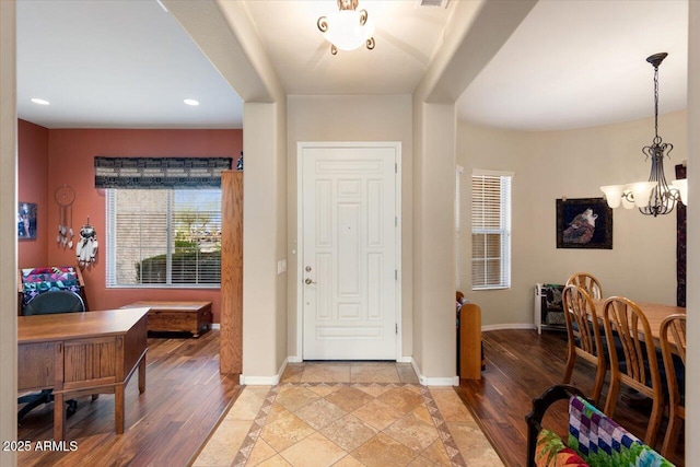 entrance foyer featuring a chandelier