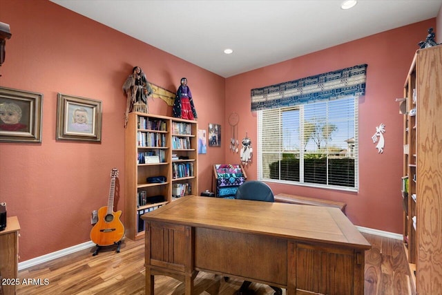 office with light wood-type flooring