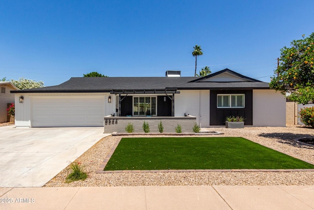 ranch-style home with a garage, concrete driveway, and a front lawn