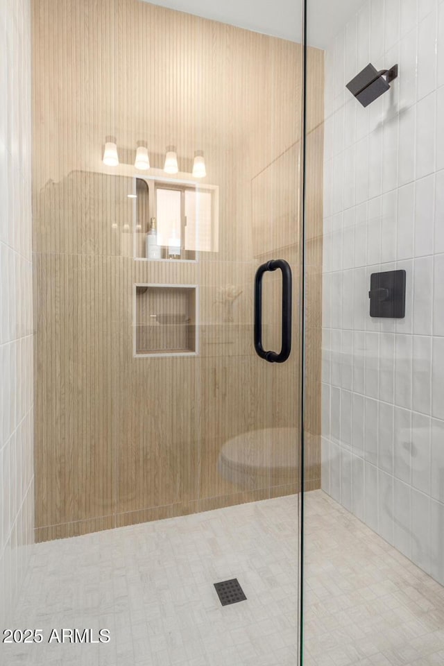 bathroom featuring a shower stall