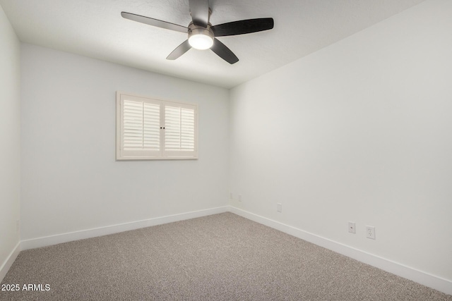 carpeted empty room with baseboards and ceiling fan