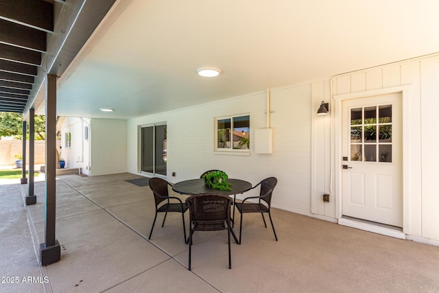 view of patio featuring outdoor dining area