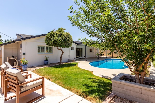 swimming pool featuring a patio area