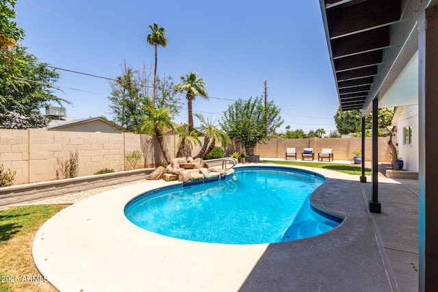 view of pool featuring a patio and a fenced backyard