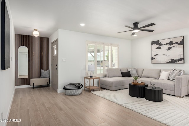 living room with wood finished floors, ceiling fan, recessed lighting, and baseboards