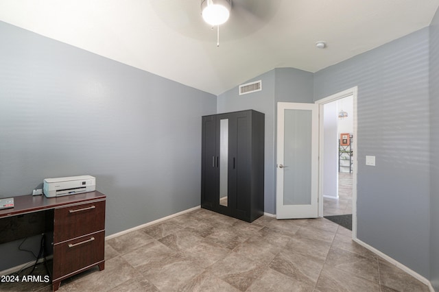 office featuring ceiling fan, french doors, and lofted ceiling