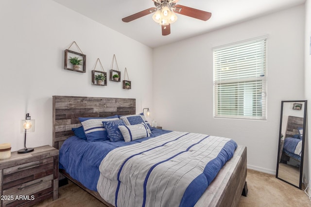 bedroom with ceiling fan and carpet