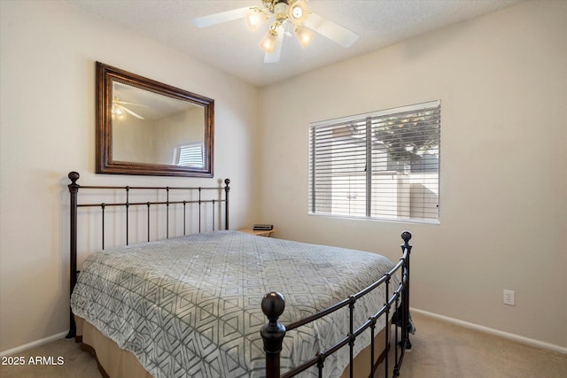 bedroom featuring carpet floors, baseboards, and ceiling fan