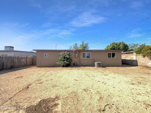 rear view of property with central air condition unit