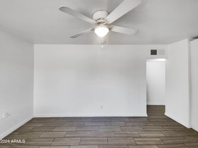 empty room featuring ceiling fan and wood-type flooring