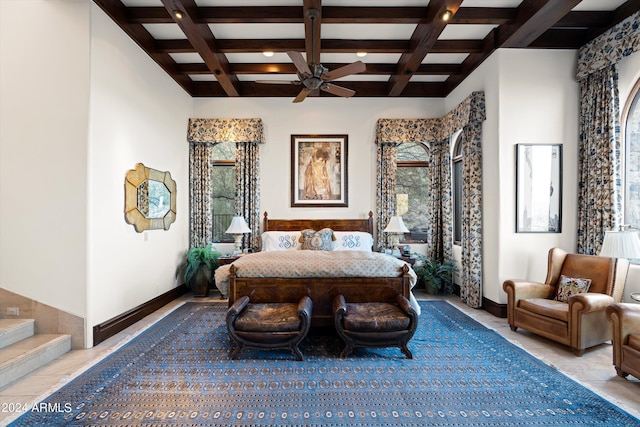 bedroom featuring beam ceiling, light tile patterned floors, and coffered ceiling