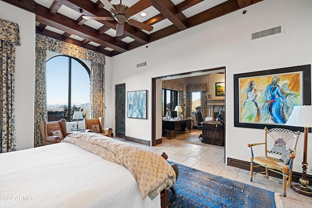 bedroom featuring a high ceiling, beam ceiling, ceiling fan, and coffered ceiling