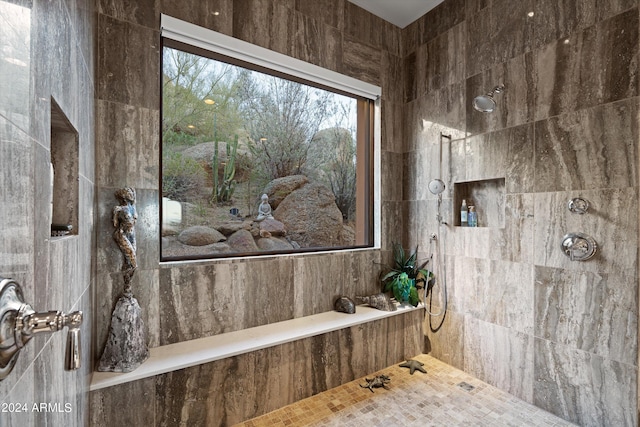 bathroom featuring tiled shower