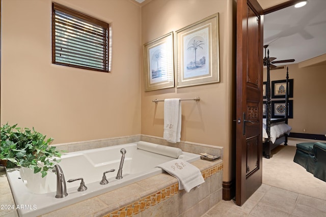 bathroom with tile patterned floors, ceiling fan, and tiled bath