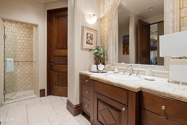 bathroom with an enclosed shower and vanity