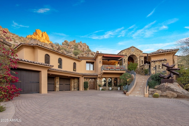 mediterranean / spanish-style home with a balcony