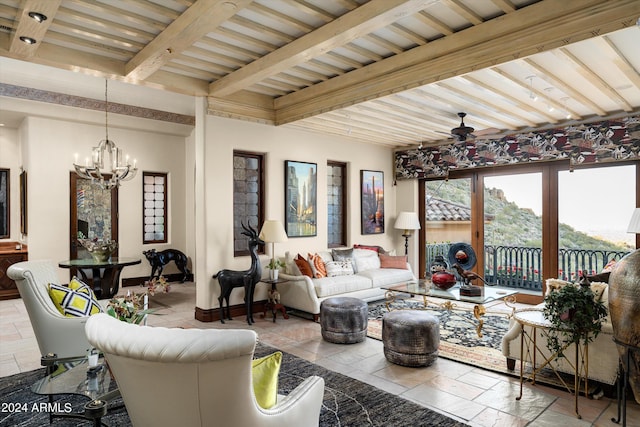 sunroom featuring ceiling fan with notable chandelier, beam ceiling, and wood ceiling