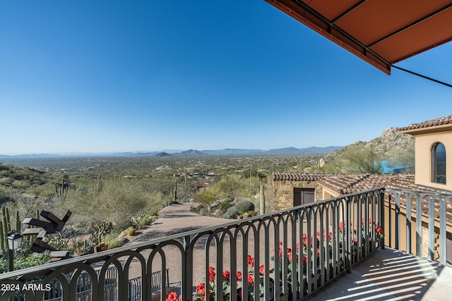 balcony featuring a mountain view