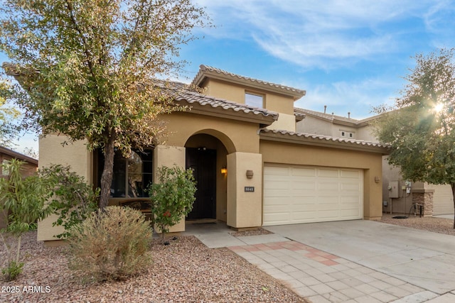 mediterranean / spanish-style home featuring a garage