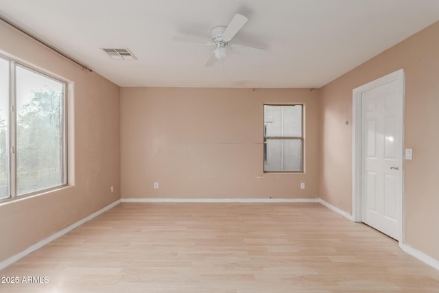 unfurnished room with ceiling fan and light hardwood / wood-style floors