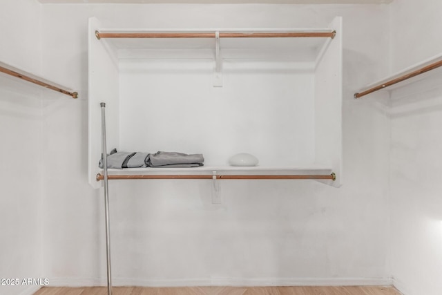 walk in closet featuring light hardwood / wood-style floors