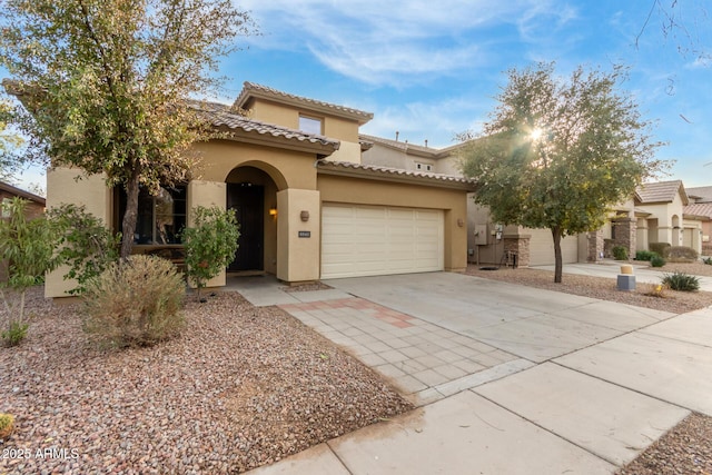 mediterranean / spanish-style home featuring a garage