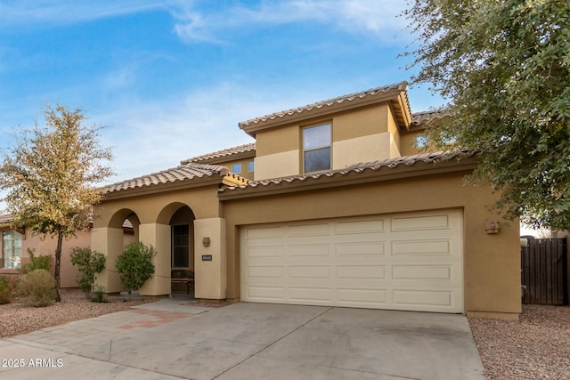 mediterranean / spanish-style house featuring a garage