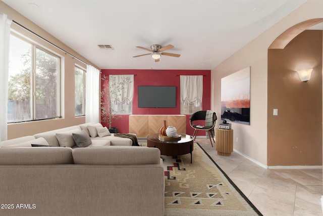 living room with ceiling fan and light tile patterned floors