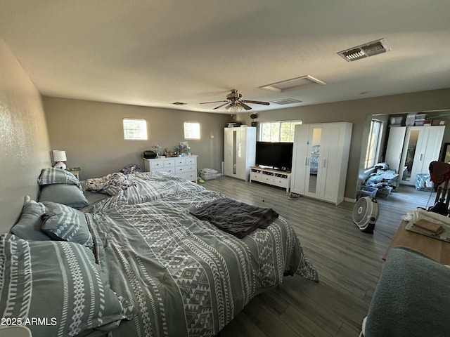 546 E San Carlos Way, Chandler, AZ 85249 - bedroom featuring multiple windows, wood finished floors, ceiling fan, and attic access
