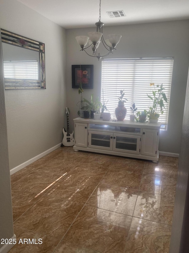 546 E San Carlos Way, Chandler, AZ 85249 - dining area featuring a chandelier, plenty of natural light, and baseboards