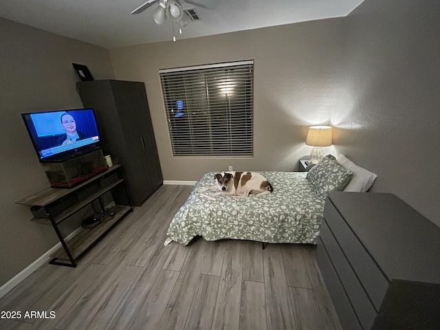 546 E San Carlos Way, Chandler, AZ 85249 - bedroom with wood finished floors, baseboards, and a ceiling fan