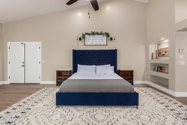 bedroom featuring ceiling fan, high vaulted ceiling, and hardwood / wood-style floors