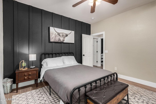 bedroom featuring ceiling fan and hardwood / wood-style floors