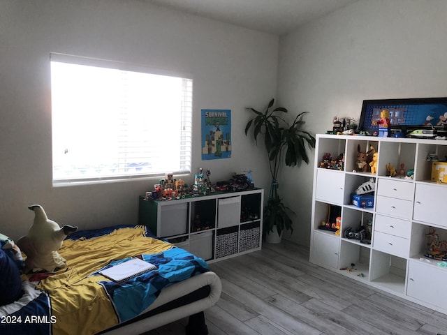 bedroom with light hardwood / wood-style floors