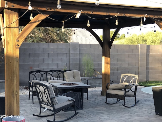 view of patio with a gazebo and a fire pit