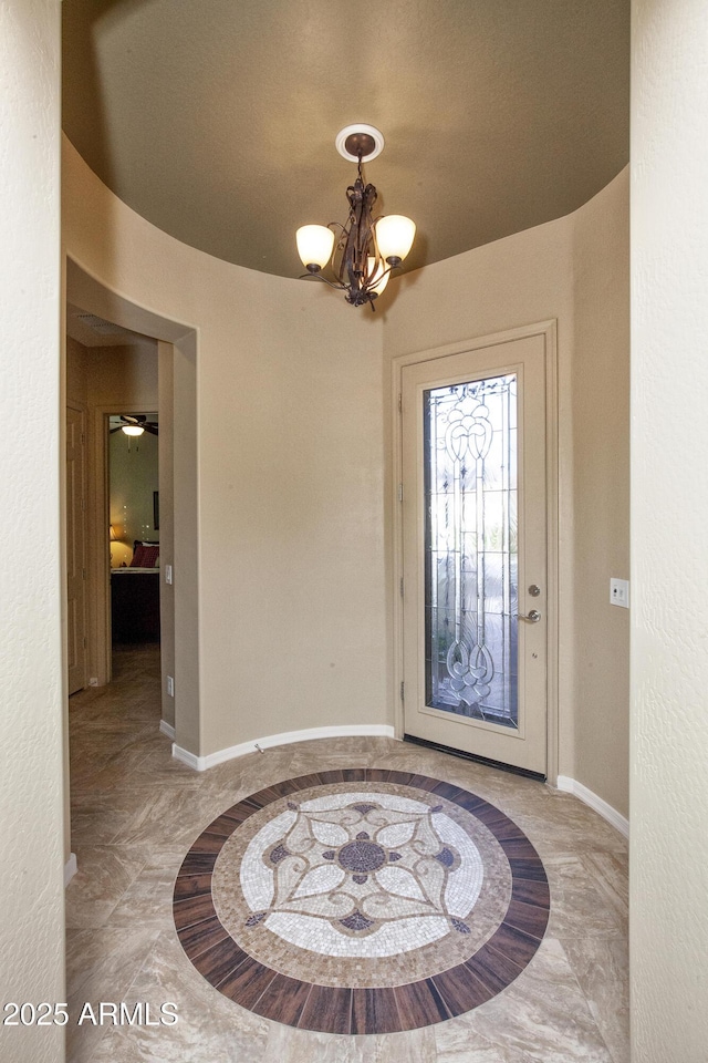 entryway featuring an inviting chandelier