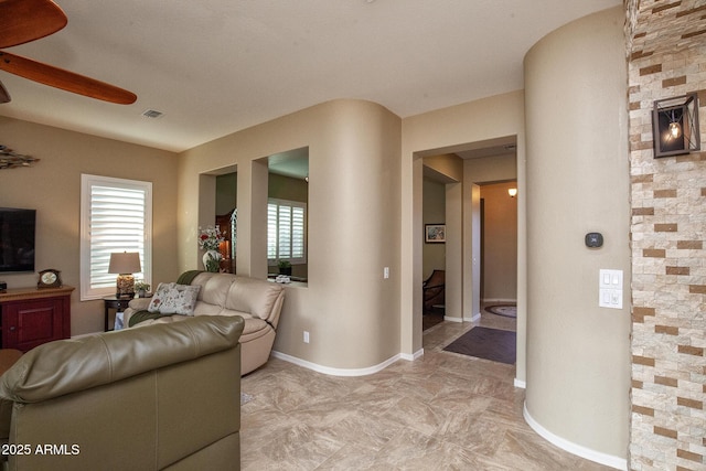 living room featuring ceiling fan