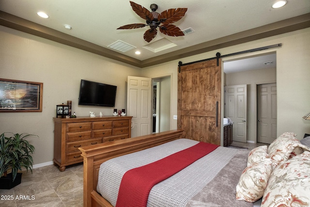 bedroom with a barn door and ceiling fan