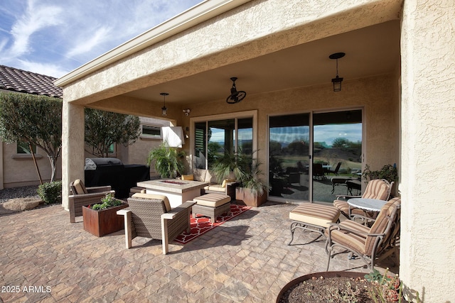 view of patio / terrace with a fire pit