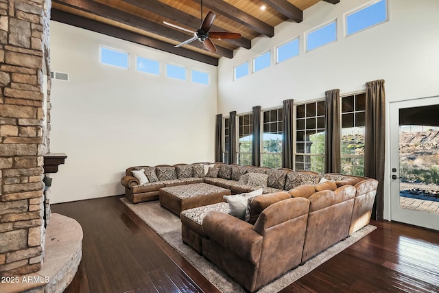 living room with wood ceiling, ceiling fan, a towering ceiling, dark hardwood / wood-style floors, and beamed ceiling