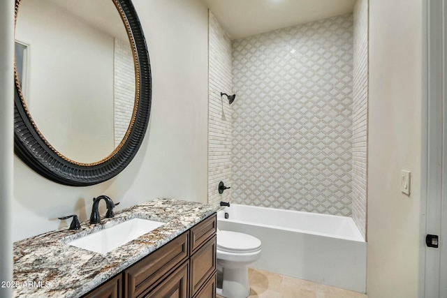 full bathroom featuring tiled shower / bath combo, vanity, and toilet