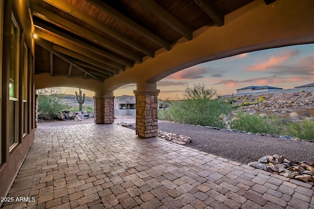 view of patio terrace at dusk