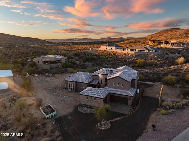 aerial view at dusk with a mountain view