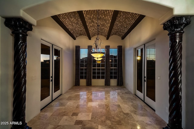 wine room featuring french doors and brick ceiling